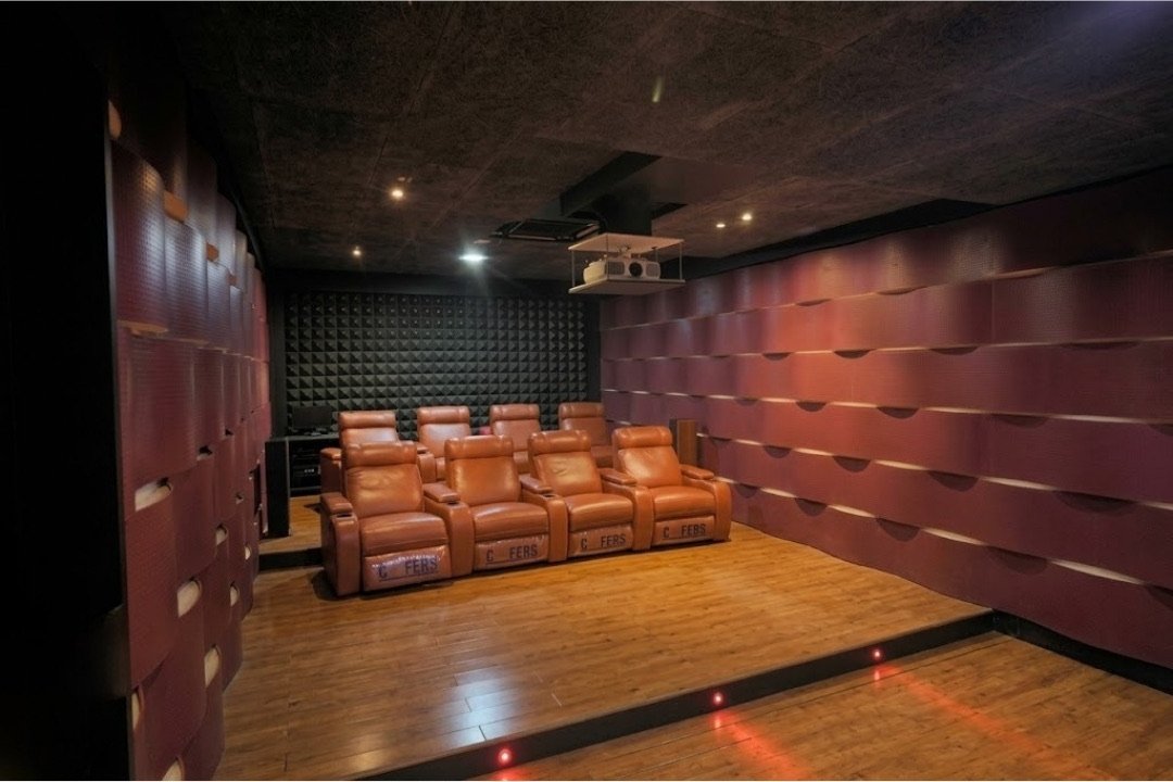 Private home theatre with recliner seating by HOH Luxe